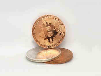 Close-up of coins on white background