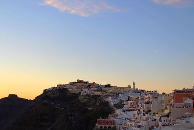 Cityscape against clear sky during sunset