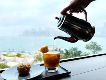 Close-up of pouring drink on table