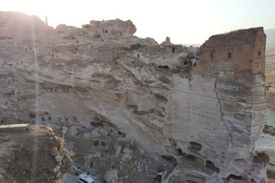 Low angle view of rock formations against sky