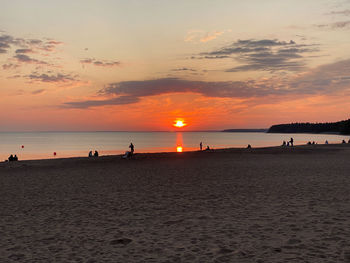 Scenic view of beach against sky during sunset