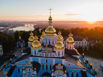 Cathedral against sky during sunset in city