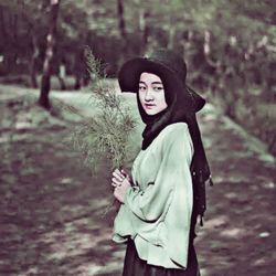 Portrait of a young woman in the forest