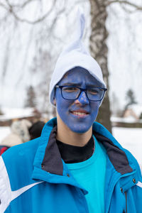 Portrait of young man in snow