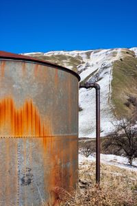 Abandoned built structure on field against clear sky