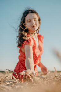 Girl wearing mask against clear sky