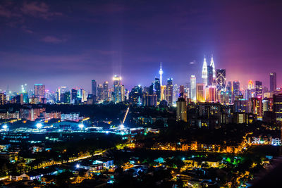 Illuminated buildings in city at night