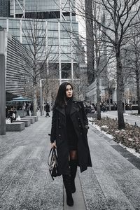 Woman walking in city during winter