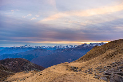 Scenic view of mountains against sky during sunset