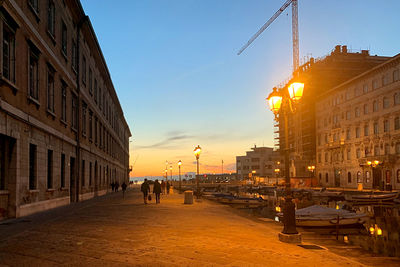 View of street and buildings at sunset