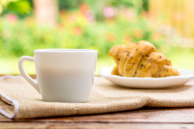 Close-up of coffee cup on table