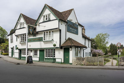 Building by street against sky
