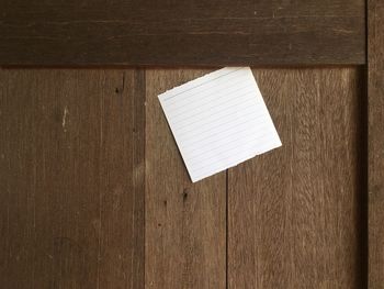 Directly above shot of paper on wooden table