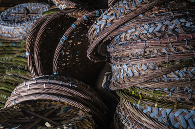 Close-up of stacked wicker baskets for sale