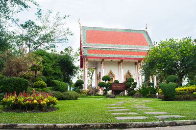 Gazebo in park against building