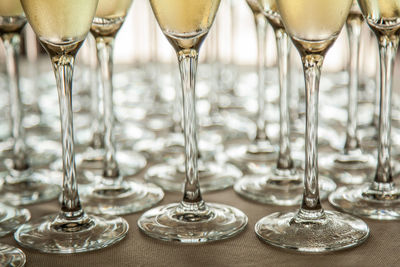 Close-up of wine glasses on table