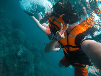 People scuba diving in sea