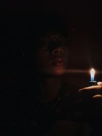 Portrait of teenage girl with light painting at night