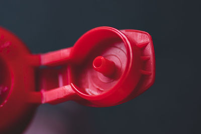 Close-up of red toy against black background