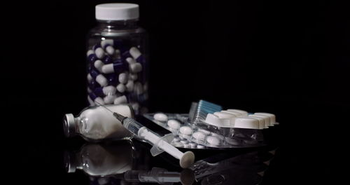 Close-up of pills in bottles