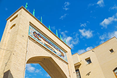 Low angle view of historical building against blue sky