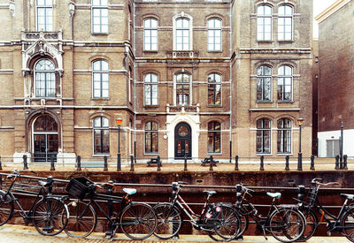 Bicycles and canal against building in city