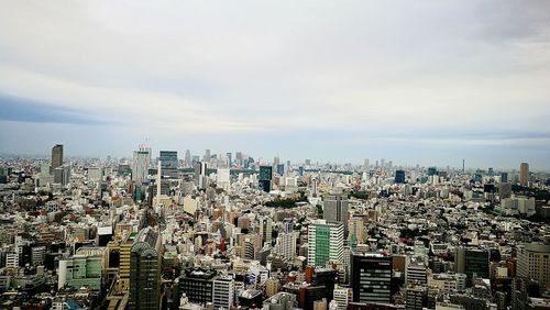 Aerial view of cityscape against sky