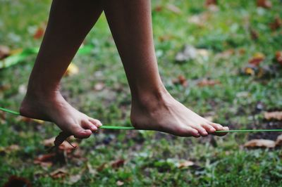 Low section of woman standing in park