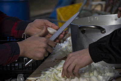Cropped image of people preparing food