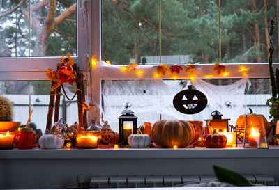 Close-up of illuminated lanterns at home