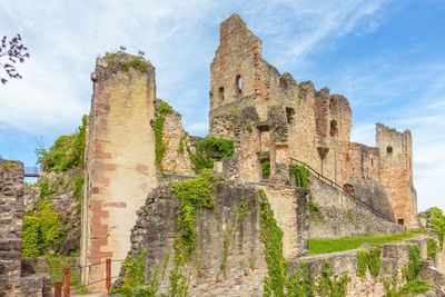 Low angle view of old ruin building against sky