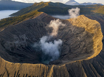 Smoke emitting from volcanic mountain at bromo tengger semeru national park, east java, indonesia