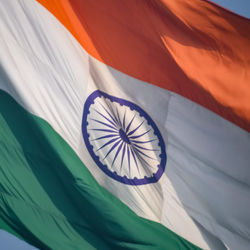 India flag flying high at connaught place with pride in blue sky, india flag fluttering, indian flag