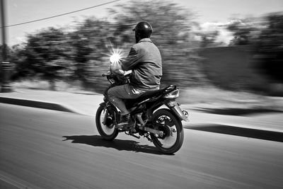 Man cycling on road