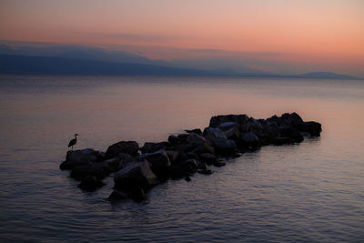 Scenic view of sea against sky at sunset