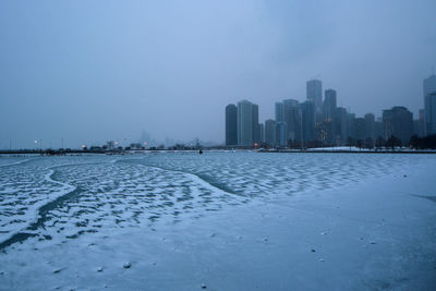 Frozen lake michigan by city during winter