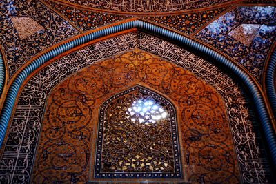 Low angle view of ornate ceiling of building