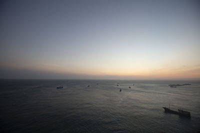 Scenic view of sea against clear sky during sunset