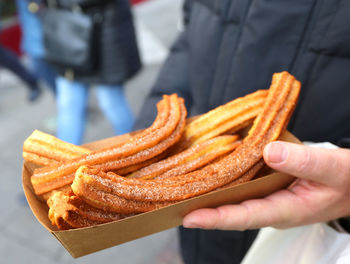 Close-up of hand holding burger