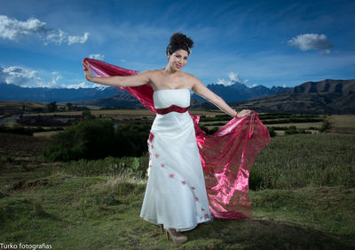 Woman standing on grassy field