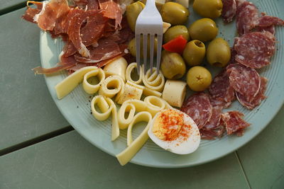 High angle view of vegetables in plate on table