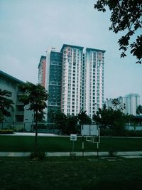 Buildings in city against sky