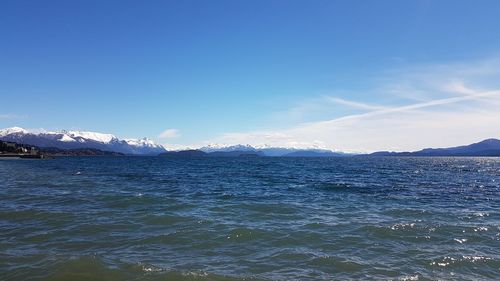 Scenic view of sea against blue sky