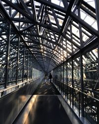 People walking on footbridge