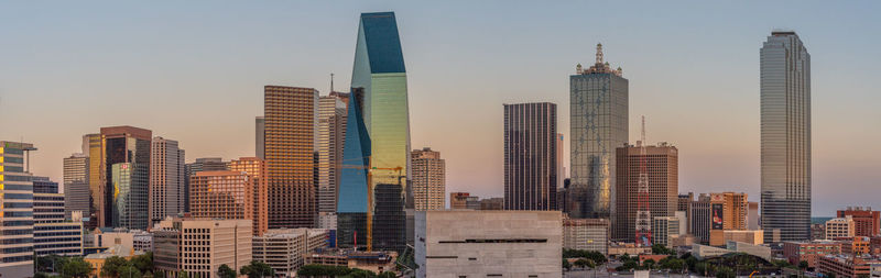 Skyscrapers in city against sky