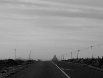 Empty road along landscape