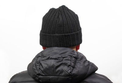 Rear view of person wearing hat against white background