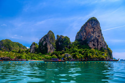 Scenic view of rock formation in sea against sky