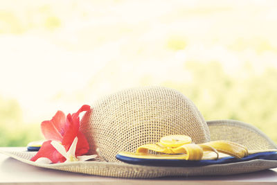 Close-up of flower on hat