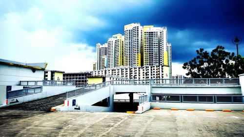 Low angle view of building against cloudy sky